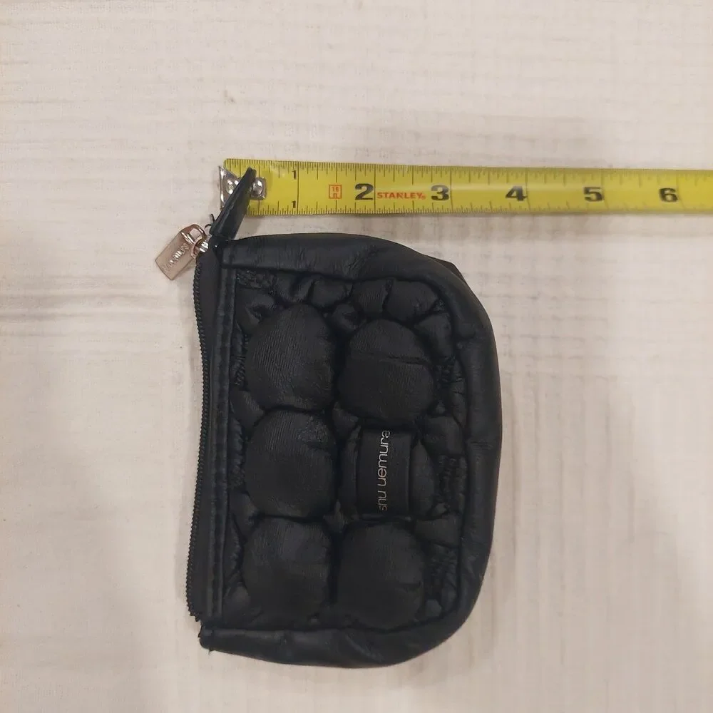 black quilted novelty cosmetic pouch from Shu Uemura
